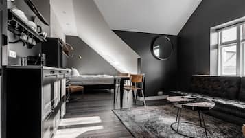Penthouse Studio with Kitchenette | Premium bedding, desk, laptop workspace, blackout drapes