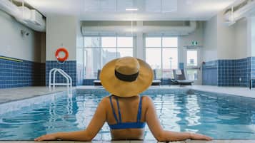 Indoor pool, open 8:00 AM to 10:00 PM, pool loungers