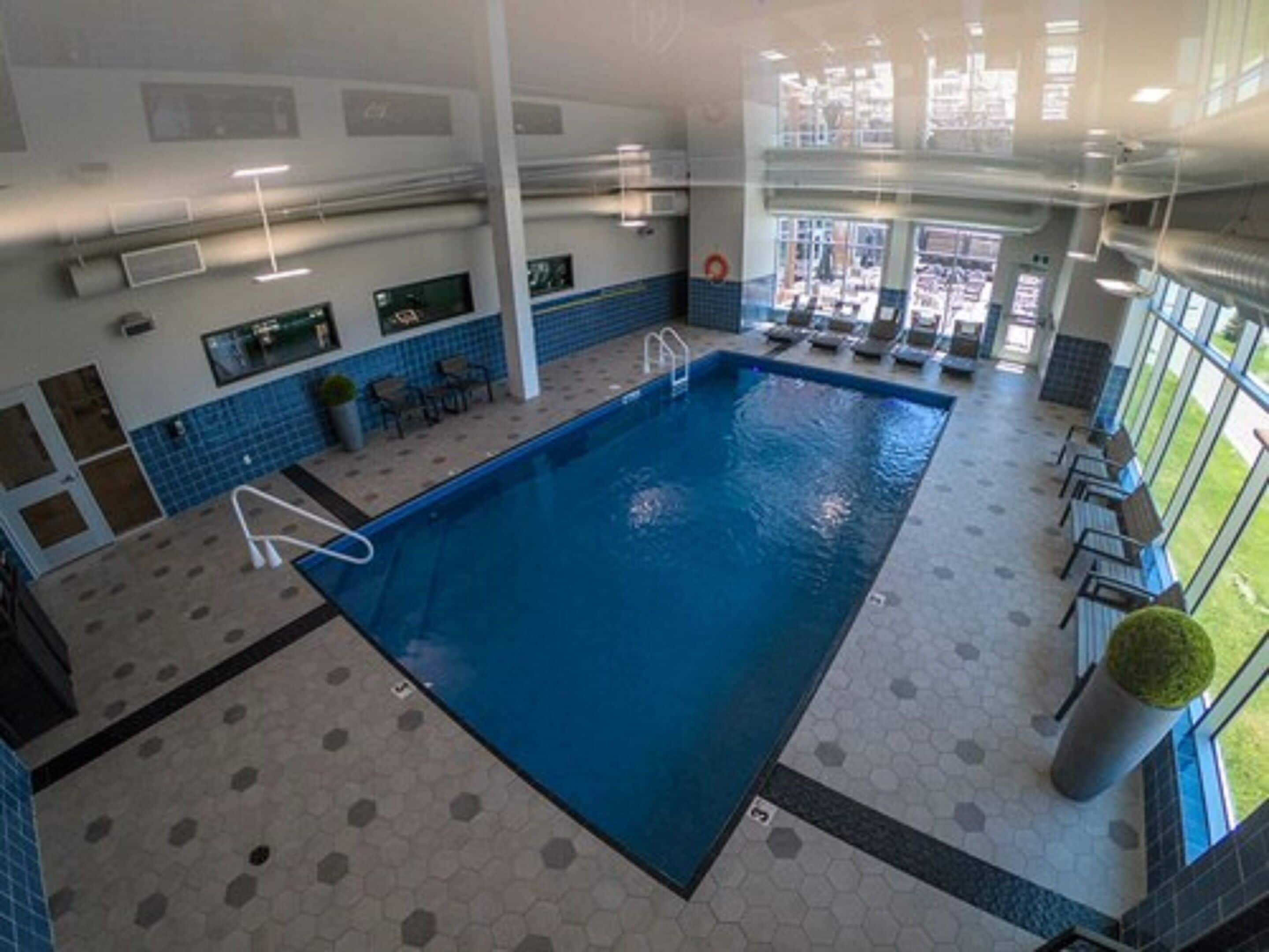 indoor pool, open 8:00 am to 10:00 pm, pool loungers