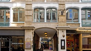 A building with a sign reading "Gree Church Buildings" and a storefront with a sign "Association Coffee". - Native Fenchurch  (London)