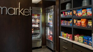 A refrigerated display case with snacks and beverages.