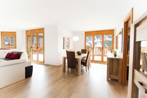 Apartment, 3 Bedrooms | Living area | Flat-screen TV