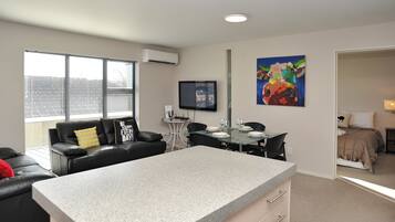 Apartment, 2 Bedrooms | Living area | Flat-screen TV