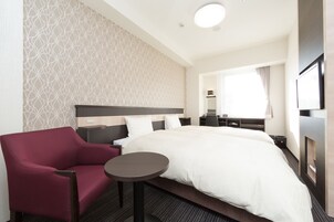 Down comforters, desk, blackout drapes, iron/ironing board