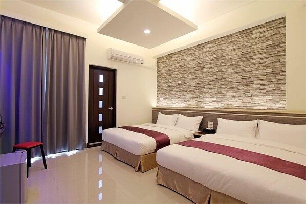Grand Quadruple Room, 1 Bedroom | Minibar, desk, blackout curtains, soundproofing