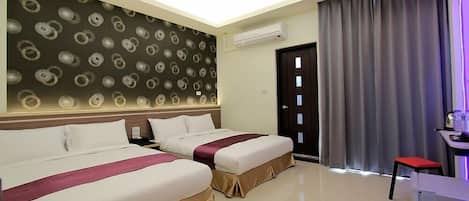Grand Quadruple Room, 1 Bedroom | Minibar, desk, blackout drapes, soundproofing