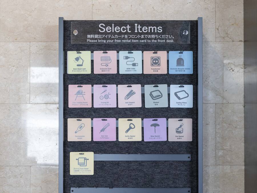 A wall-mounted sign listing various rental items with icons and descriptions.
