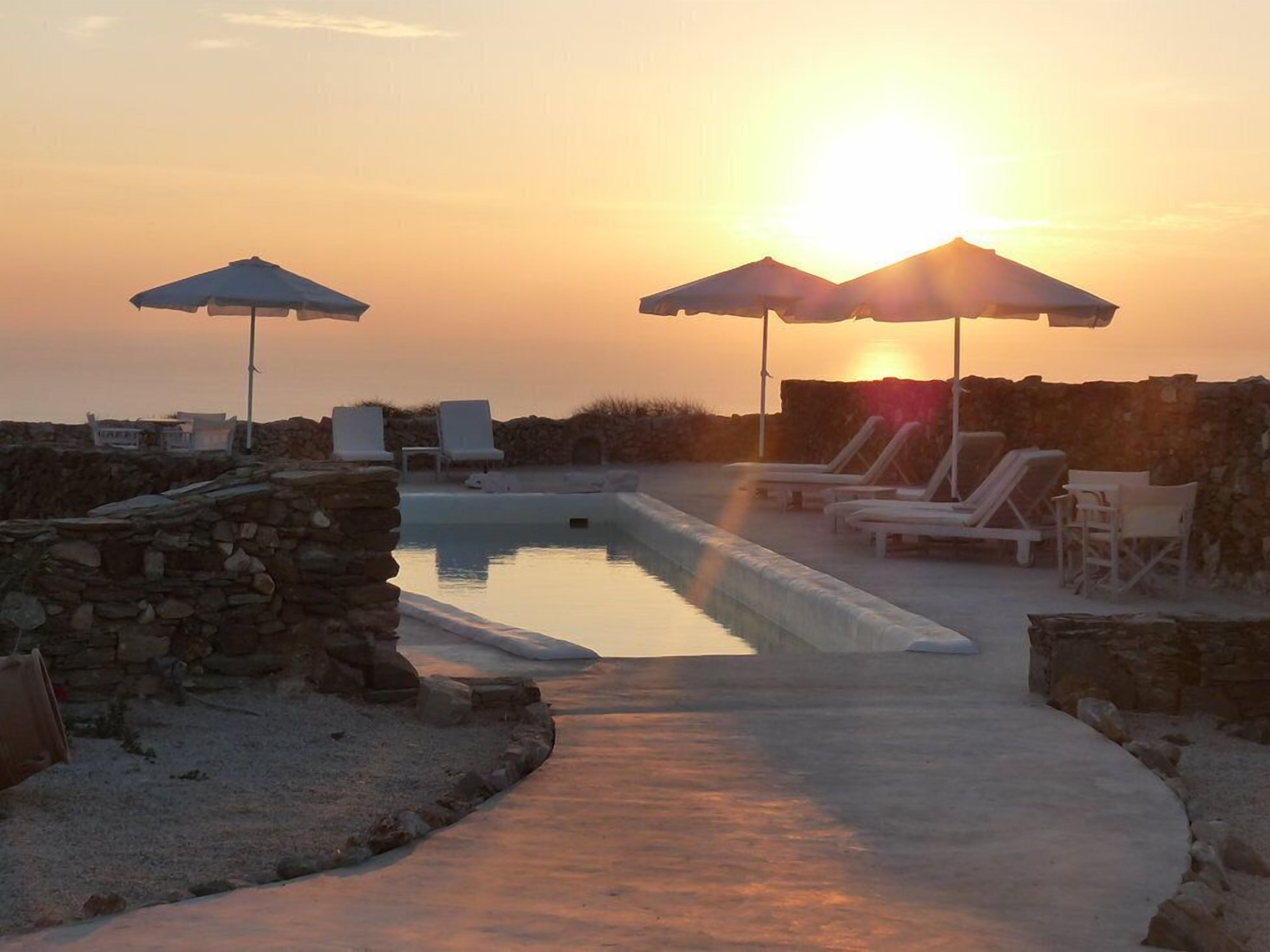 Seasonal outdoor pool, pool umbrellas, pool loungers