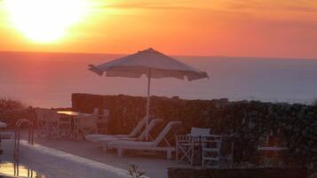 Seasonal outdoor pool, pool umbrellas, pool loungers