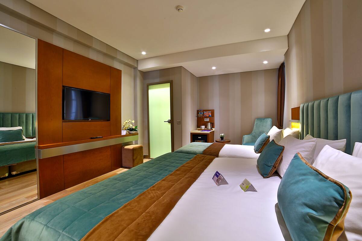 Family Room | Minibar, in-room safe, soundproofing, iron/ironing board (on request)