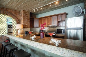Deluxe Penthouse, Ocean View | Private kitchen | Mini-fridge