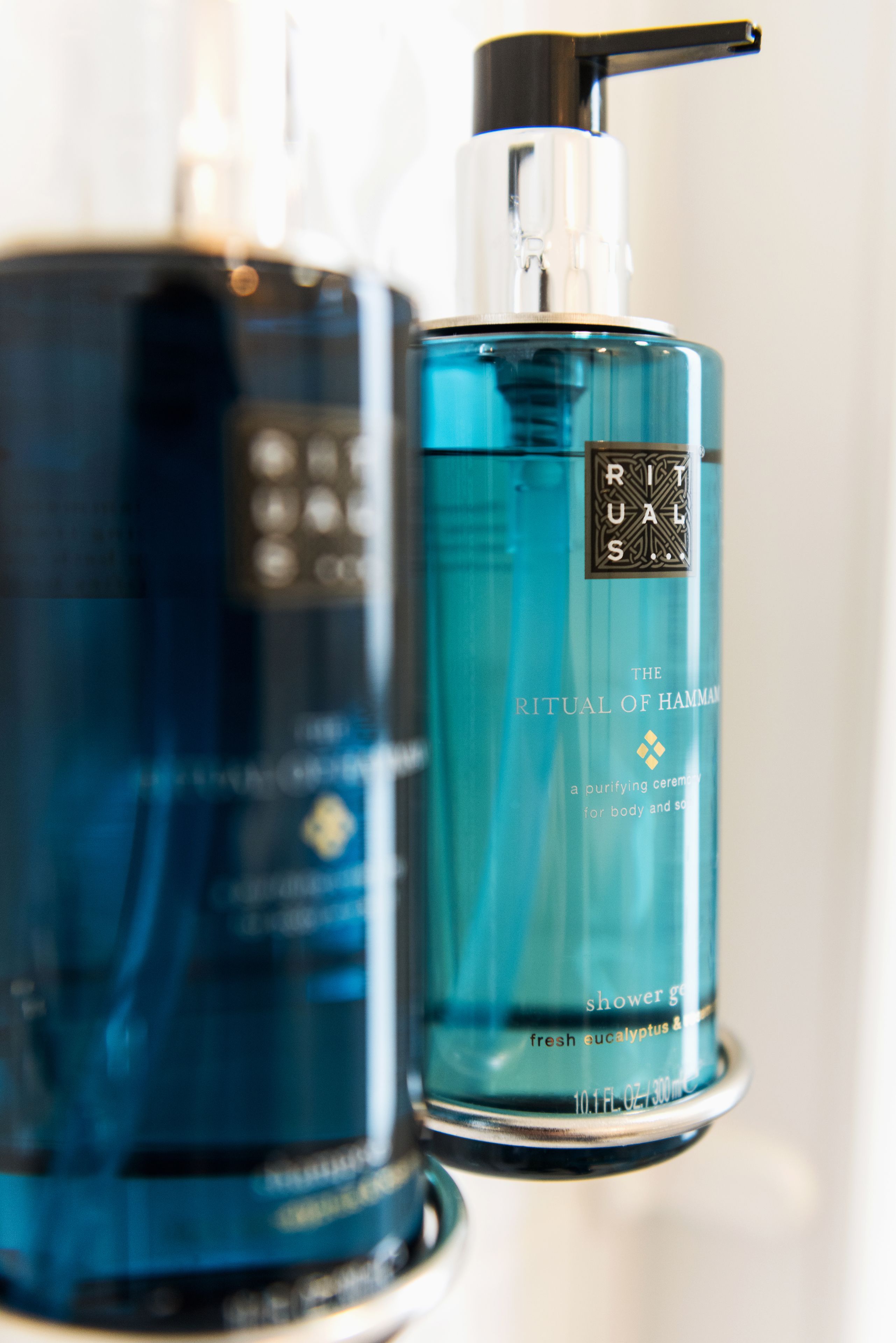 Two bottles of Rituals shower gel.