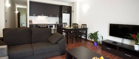 Superior Apartment | Living area | Flat-screen TV, DVD player