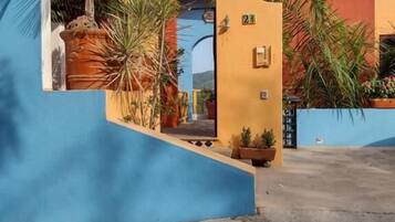 Outdoor pool, open 10:00 AM to 10:00 PM, pool loungers