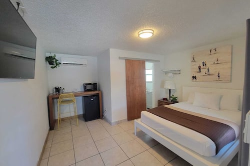 Desk, laptop workspace, blackout curtains, free WiFi