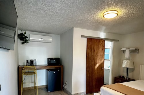 Desk, laptop workspace, blackout curtains, free WiFi