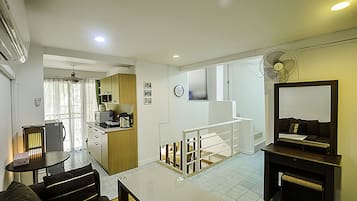 1 Bedroom Apartment, Pool Access | Living area | 32-inch TV with cable channels