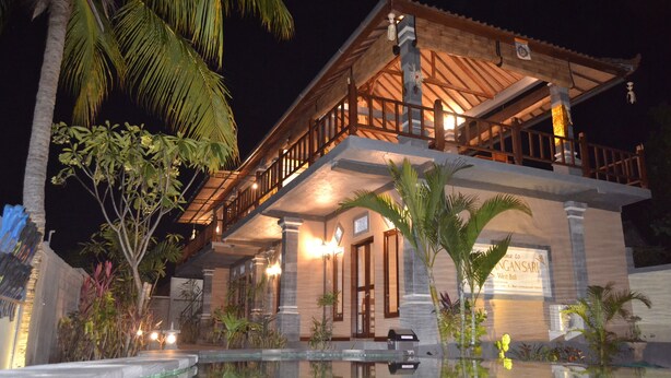 A two-story building with a pool in front. - Menjangan Sari (Pejarakan)