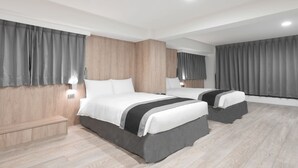 A modern hotel room with two beds, wooden paneling on the walls, and grey curtains. - Trans Inn (Taichung)