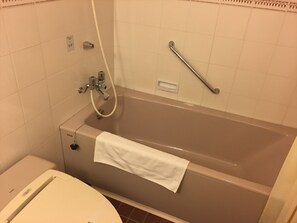 A bathroom with a bathtub, a toilet, and a shower. - Nanki Shirahama Golf Club, Nanki Shirahama Resort Hotel (Kamitonda)