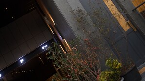 A modern building with a sign reading "HOTEL GADEN" and large windows. - Hotel Gaden by Onyu stay (Suwon)