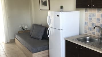 Apartment, Sea View | Private kitchen | Full-sized fridge, stovetop, coffee/tea maker, cookware/dishes/utensils