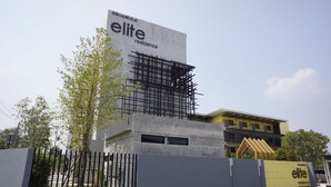 A modern building with a sign reading "elite residence." - Elite Residence Phitsanulok (Phitsanulok)