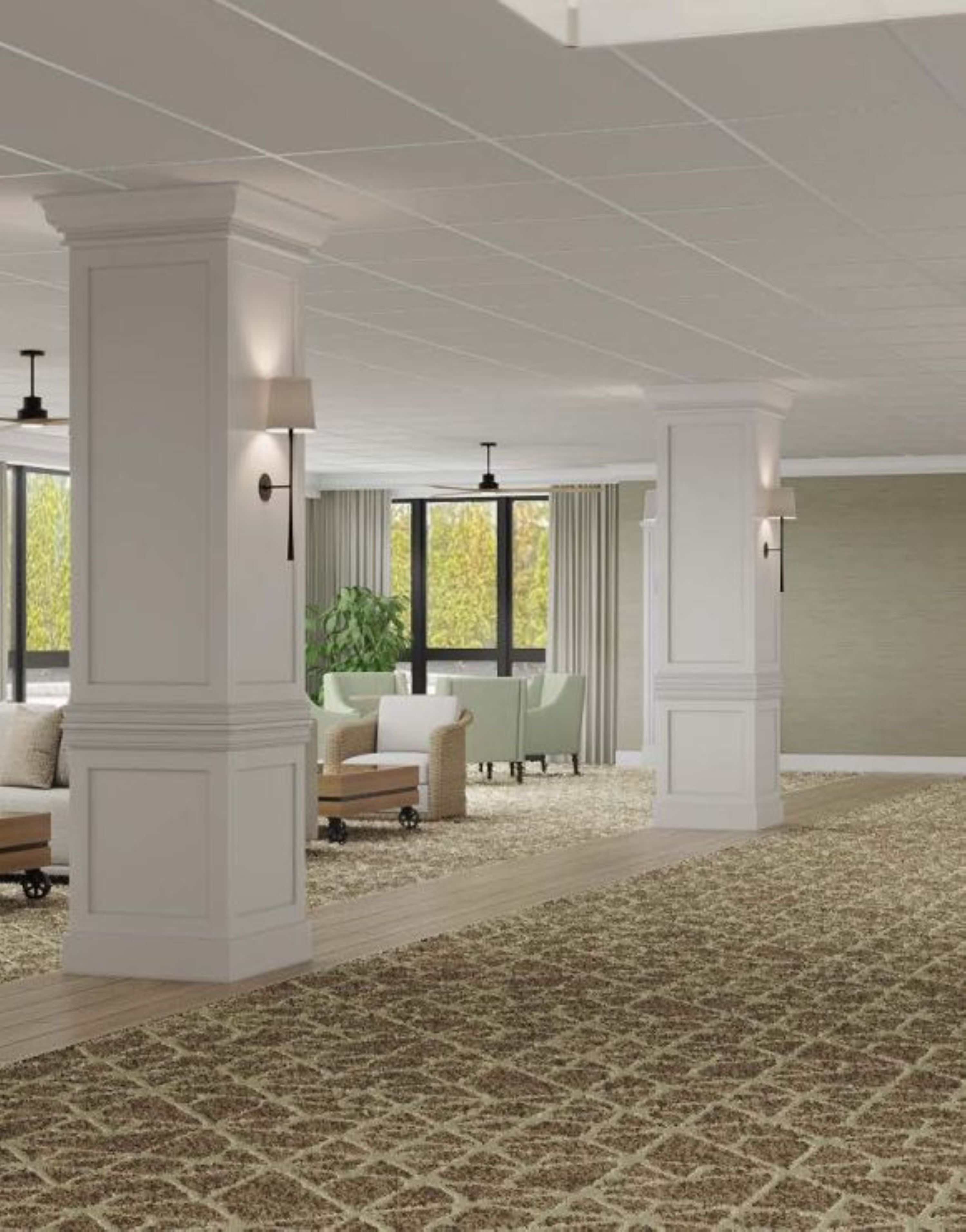 A spacious room with high ceilings, large windows, and a patterned carpet.