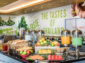 A buffet with various food items and a sign reading 'The Tastes of Thailand'. - ibis Bangkok IMPACT (Pak Kret)
