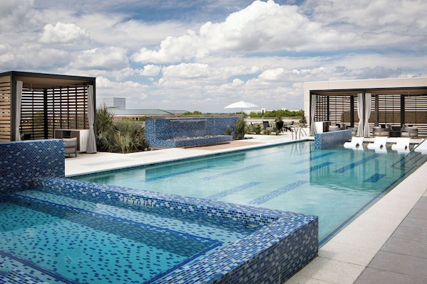 Outdoor pool, open 6:00 AM to 10:00 PM, pool cabanas (surcharge)