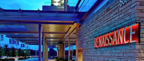 A modern building with a prominent "6007" sign and a "RENAISSANCE" sign on the side.