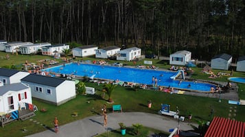 Seasonal outdoor pool, open 9:00 AM to 7:00 PM, pool umbrellas