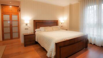 Minibar, desk, blackout curtains, iron/ironing board