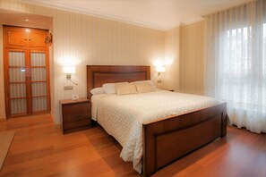 Apartment, 1 Bedroom | Minibar, desk, blackout curtains, iron/ironing board