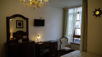 Minibar, desk, blackout curtains, iron/ironing board