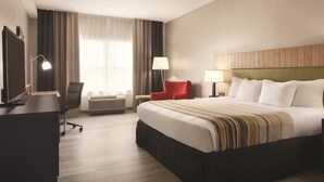 A hotel room with a bed, desk, chair, TV, and a window with curtains. - EQC Hotel 776 (Osaka)