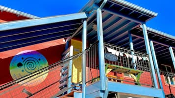 A colorful building with a sign for "Rooms" and a "Lobby" sign.