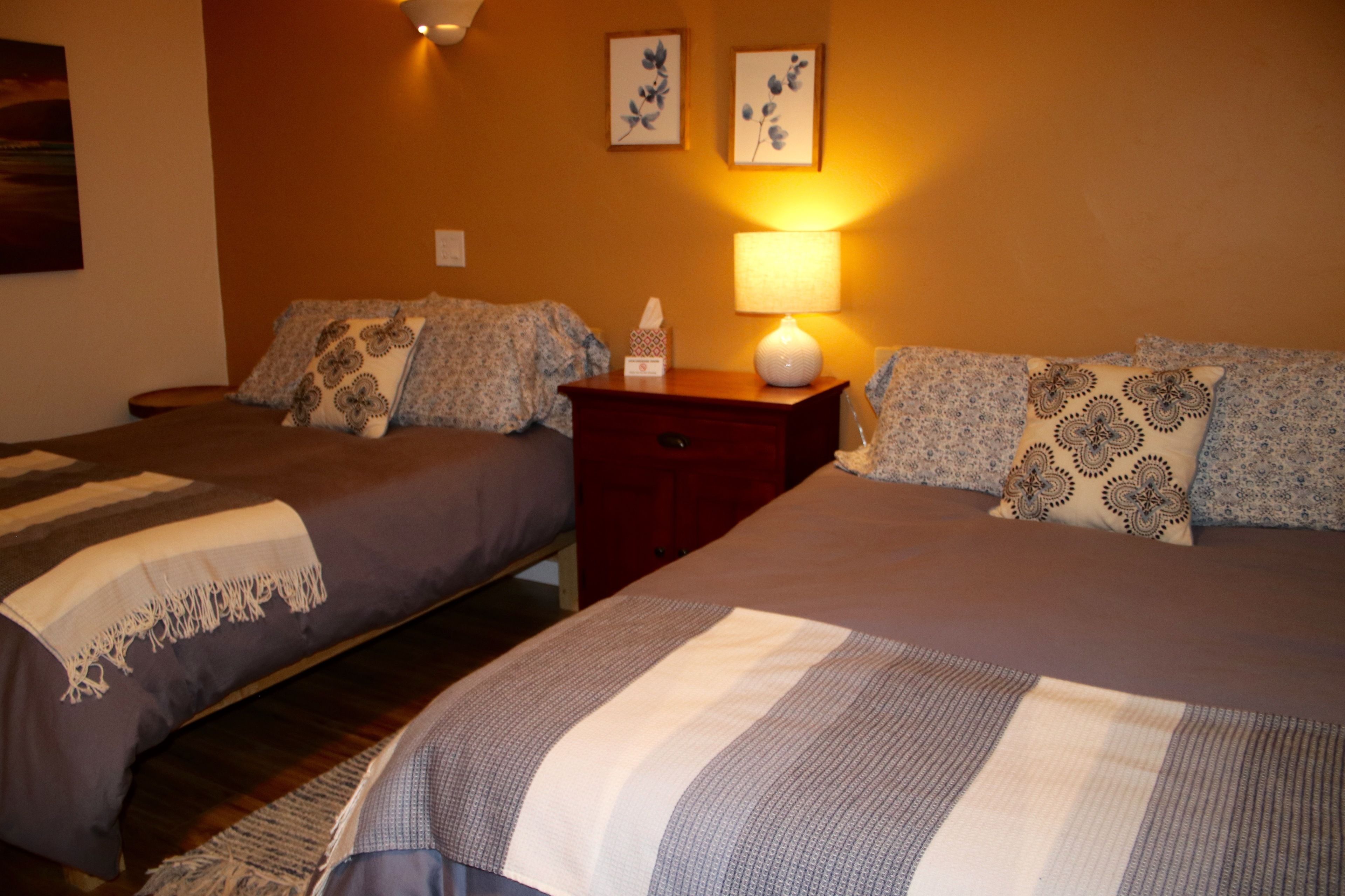 deluxe quadruple room, 2 double beds, private bathroom | premium bedding, individually decorated, individually furnished