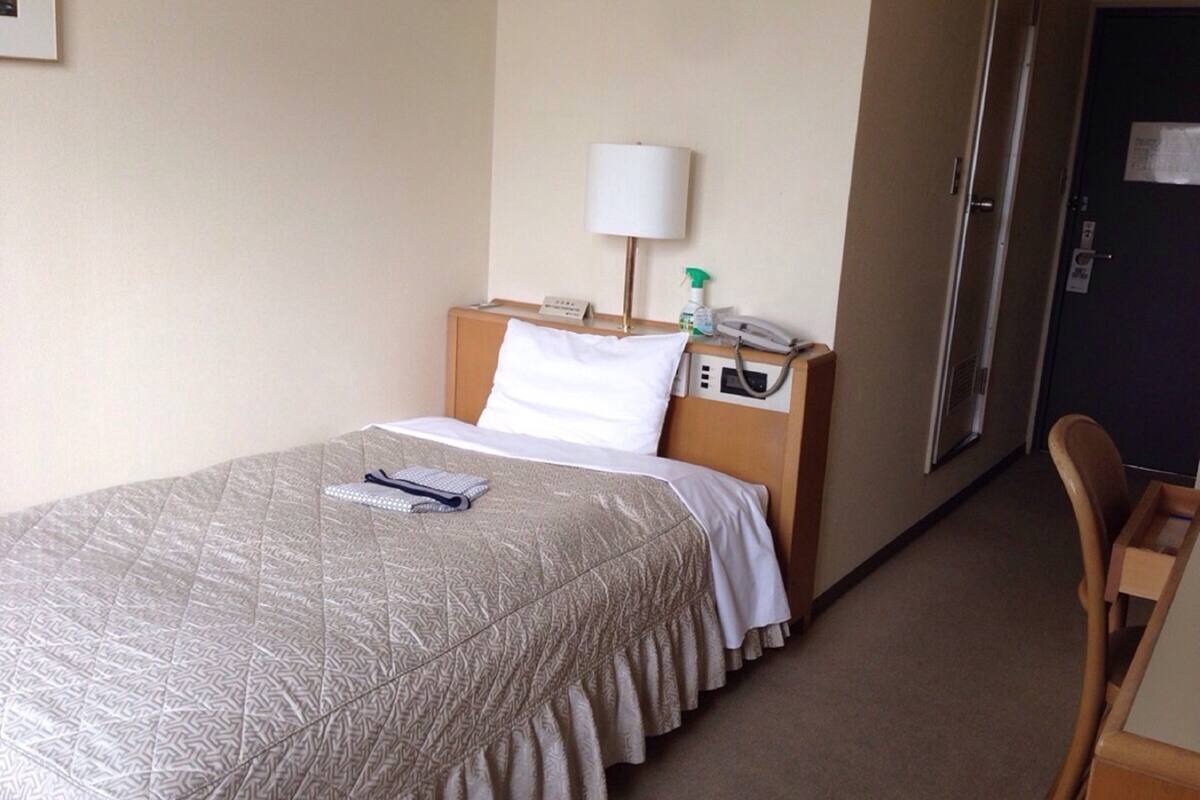 Desk, laptop workspace, blackout drapes, iron/ironing board