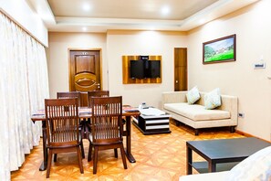 Tara Suite | Living area | Flat-screen TV - Tara Phendeyling Hotel (Thimphu)