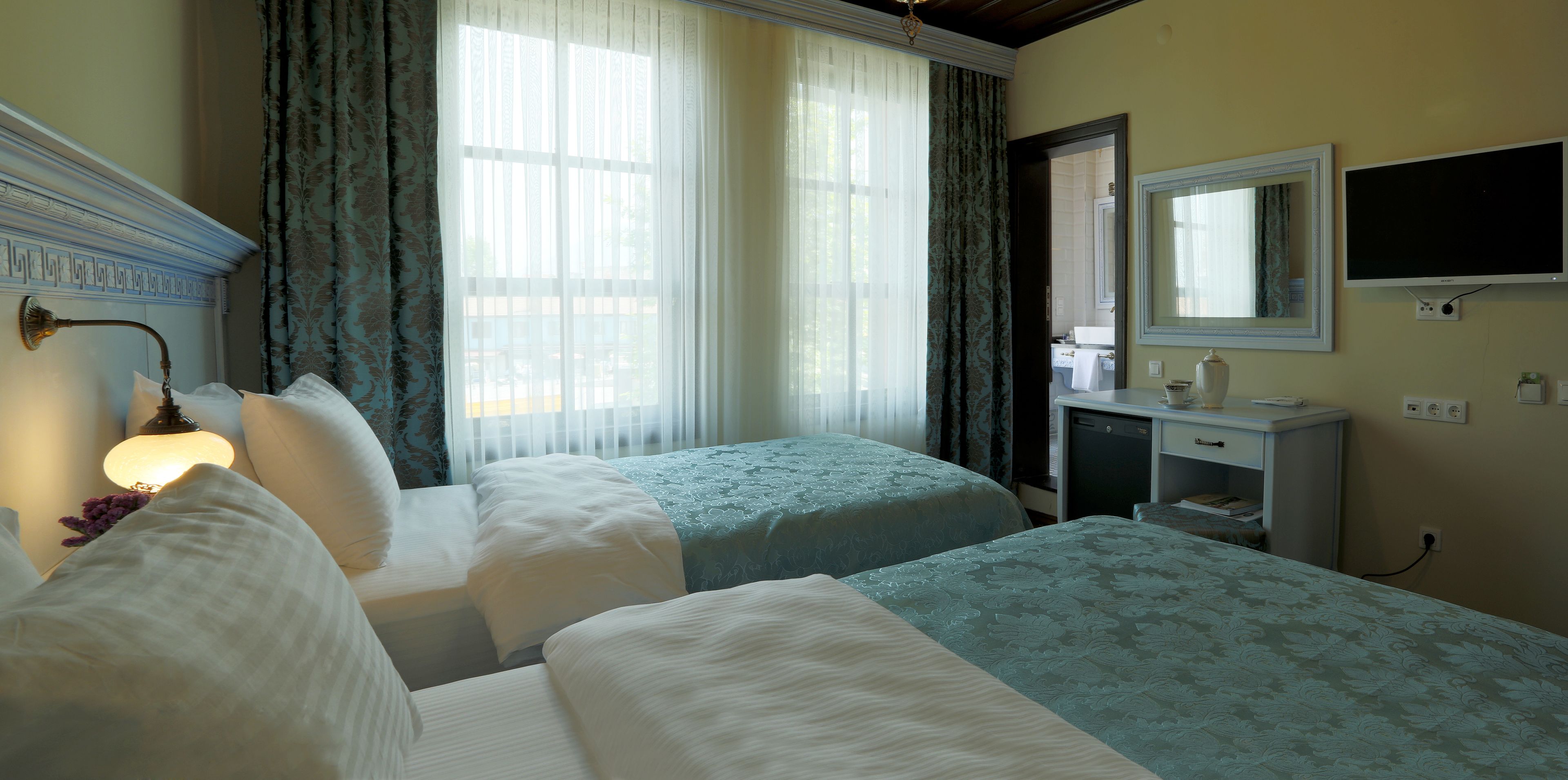 family room | 1 bedroom, minibar, in-room safe, desk