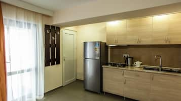 Apartment, 3 Bedrooms | Private kitchen | Full-sized fridge, stovetop, electric kettle, cookware/dishes/utensils