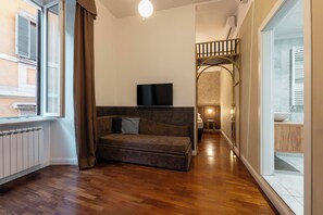 Familiesuite | Sengetøy av topp kvalitet, minibar, safe på rommet og skrivebord