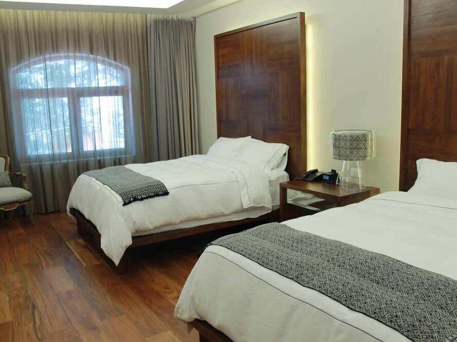 Premium bedding, down comforters, pillowtop beds, in-room safe
