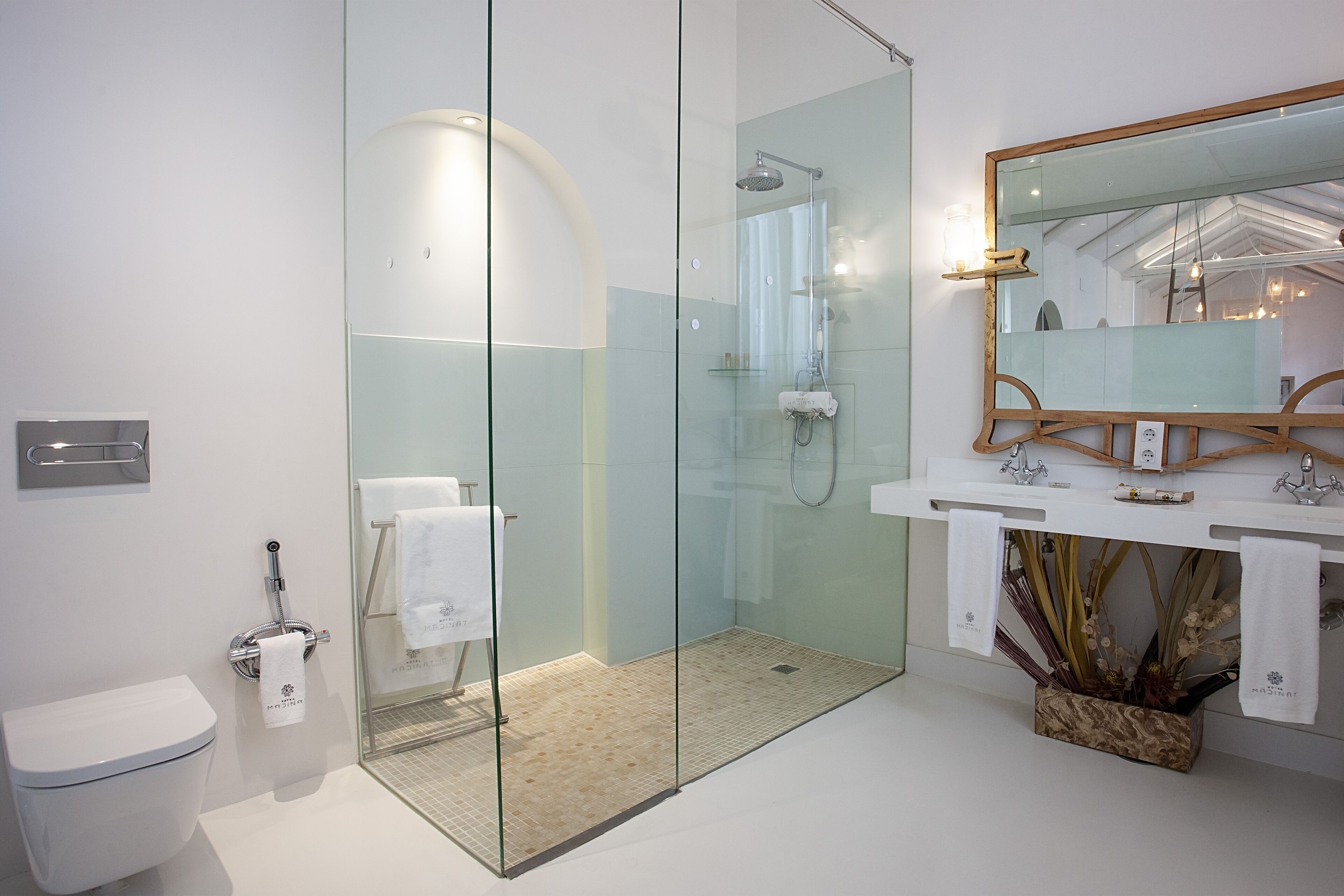 junior suite | bathroom | designer toiletries, hair dryer, bathrobes, slippers