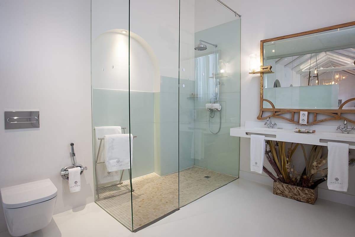 junior suite | bathroom | designer toiletries, hair dryer, bathrobes, slippers