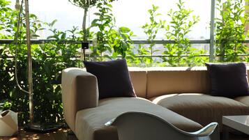 Deluxe Duplex, 2 Bedrooms, Terrace, City View | Living area | Flat-screen TV