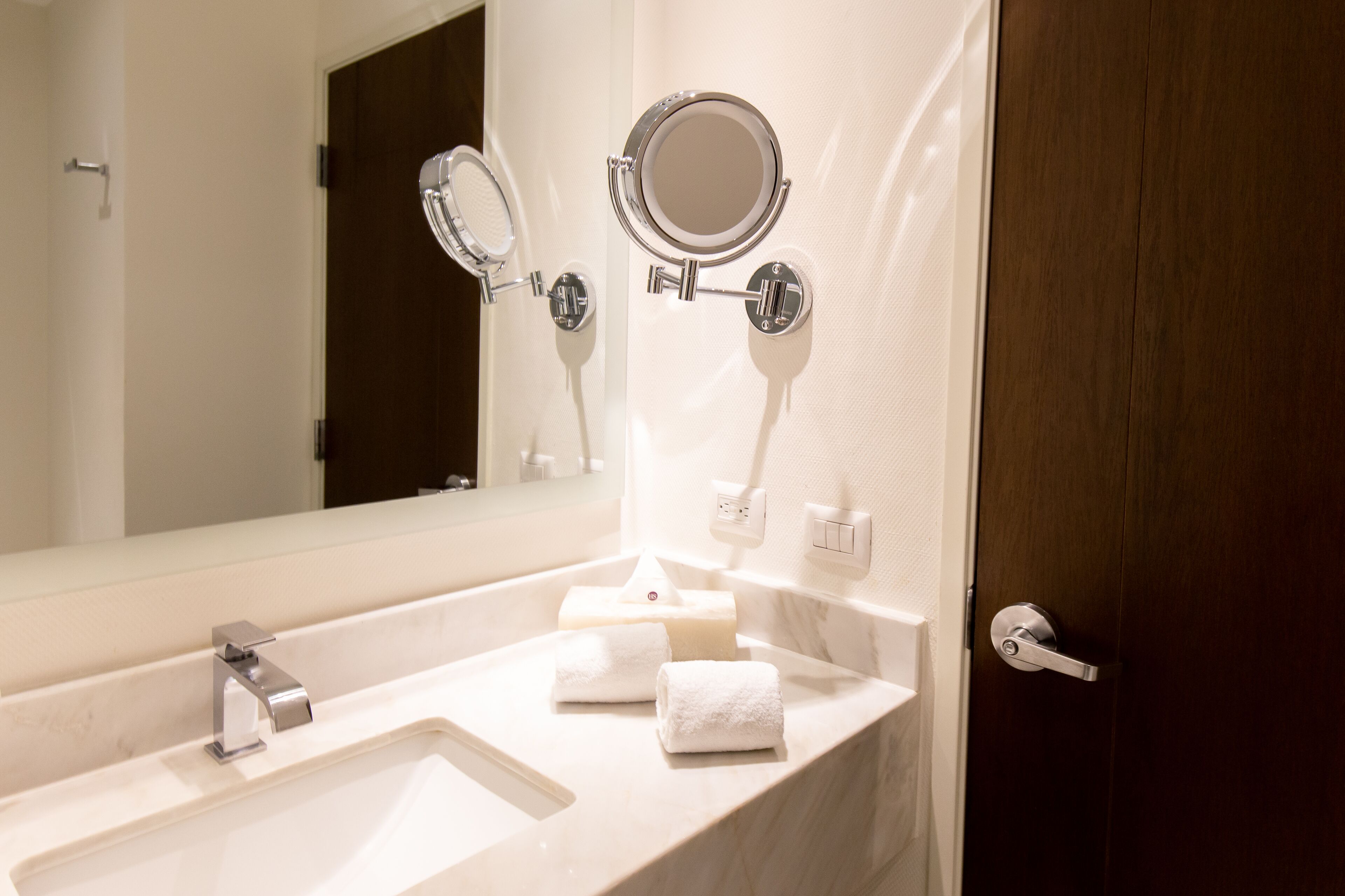 shower, designer toiletries, hair dryer, towels