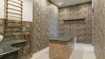 Sink, steps, and storage space are integrated into this bathroom's sleek design.
