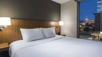 Desk, laptop workspace, iron/ironing board, free cribs/infant beds